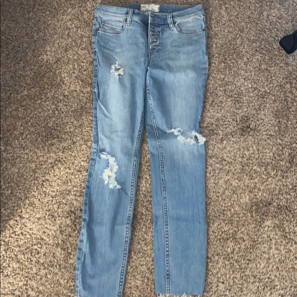 New women’s Free People ripped jeans.